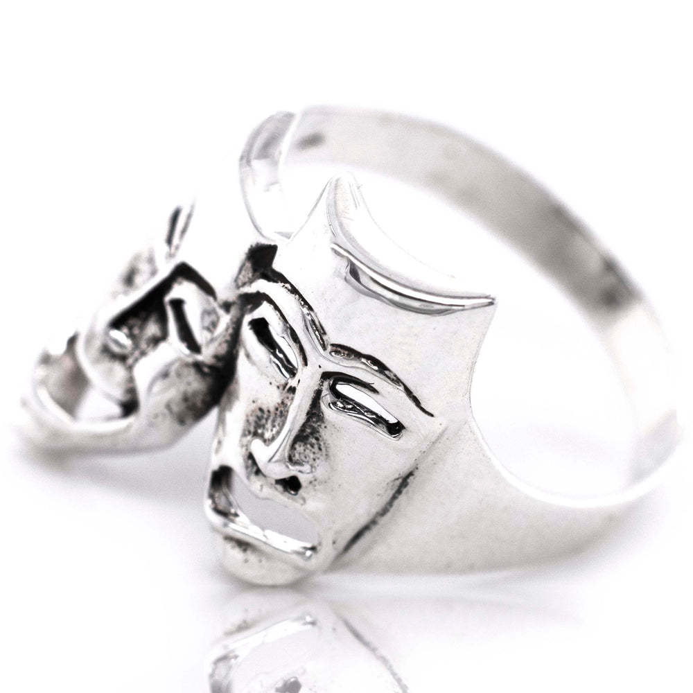 
                  
                    A Theater Masks Ring featuring comedy/tragedy mask faces by Super Silver.
                  
                