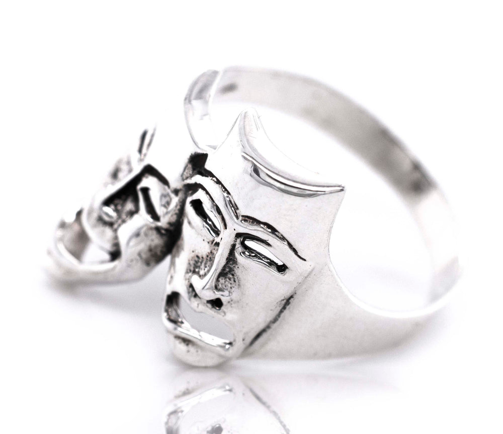 A Theater Masks Ring featuring comedy/tragedy mask faces by Super Silver.