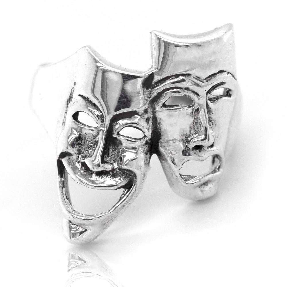 
                  
                    A fashionable Super Silver Theater Masks Ring featuring the iconic comedy/tragedy masks.
                  
                
