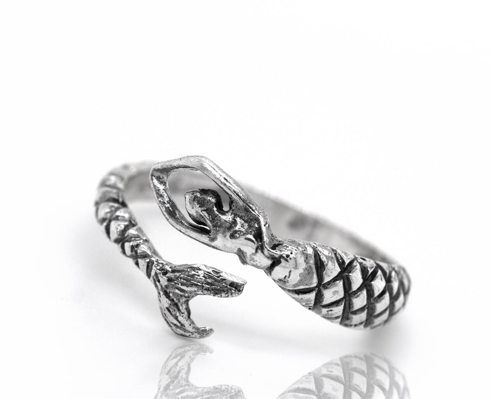 A Trendy Adjustable Mermaid Ring in sterling silver, adorned with a delicate fish, inspired by the majestic ocean.