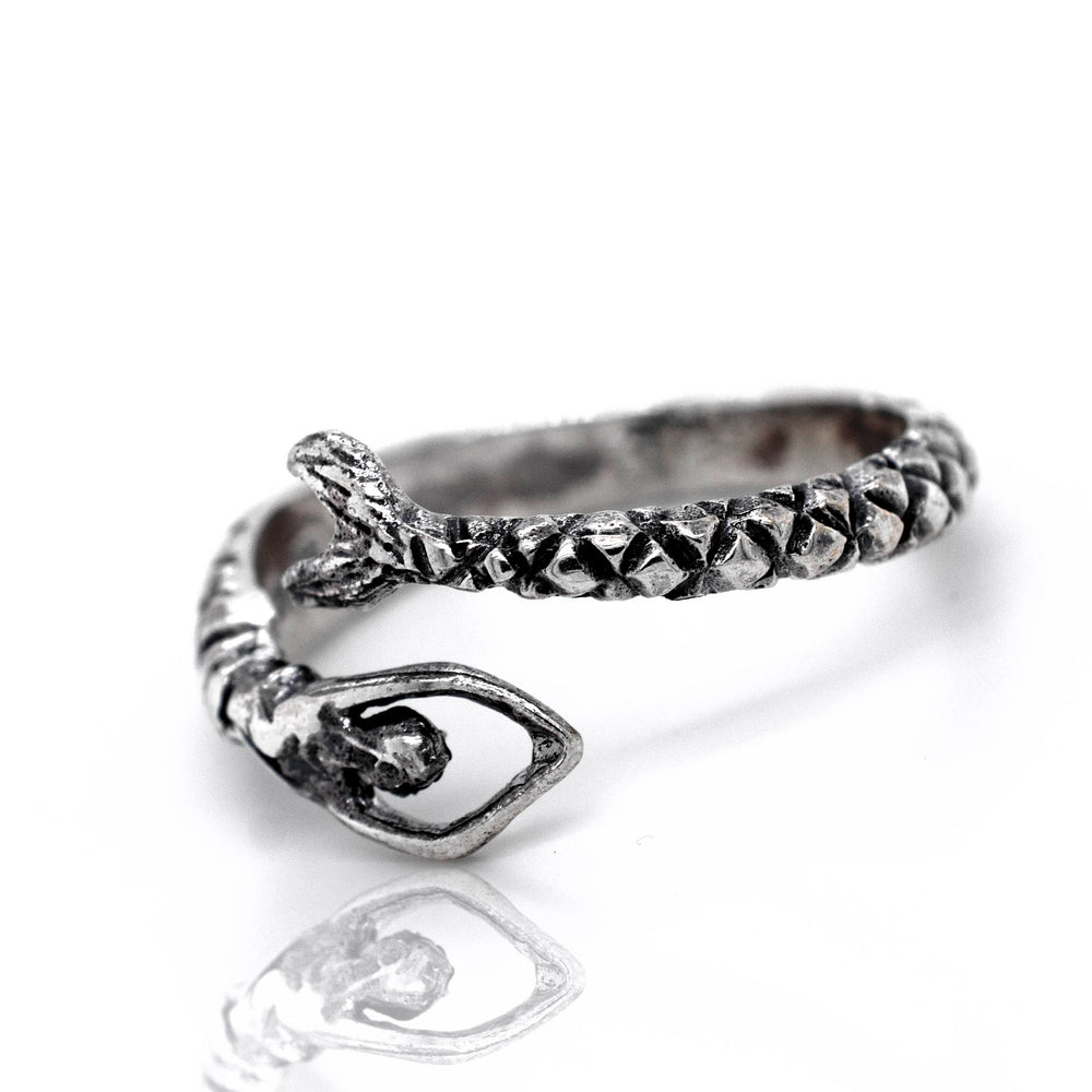 A Trendy Adjustable Mermaid Ring with a snake and stone on it.