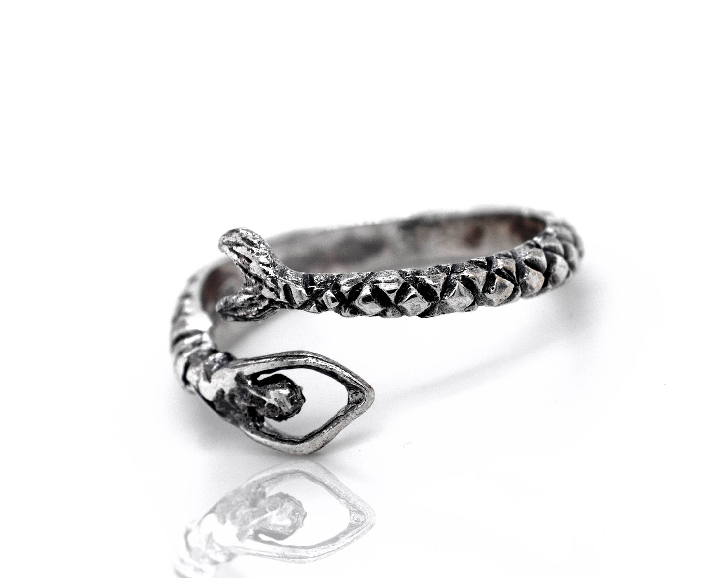 A Trendy Adjustable Mermaid Ring with a snake and stone on it.