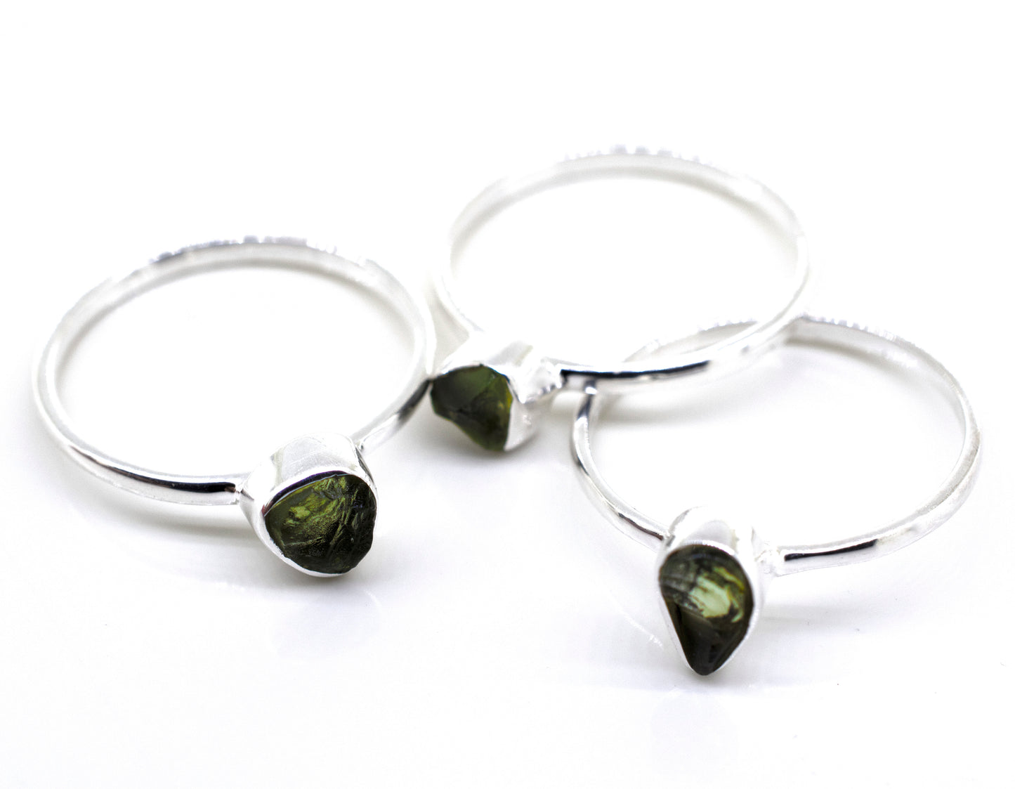 
                  
                    Three Super Silver rings with green tourmaline stones on a white surface, featuring a sterling silver setting.
                  
                