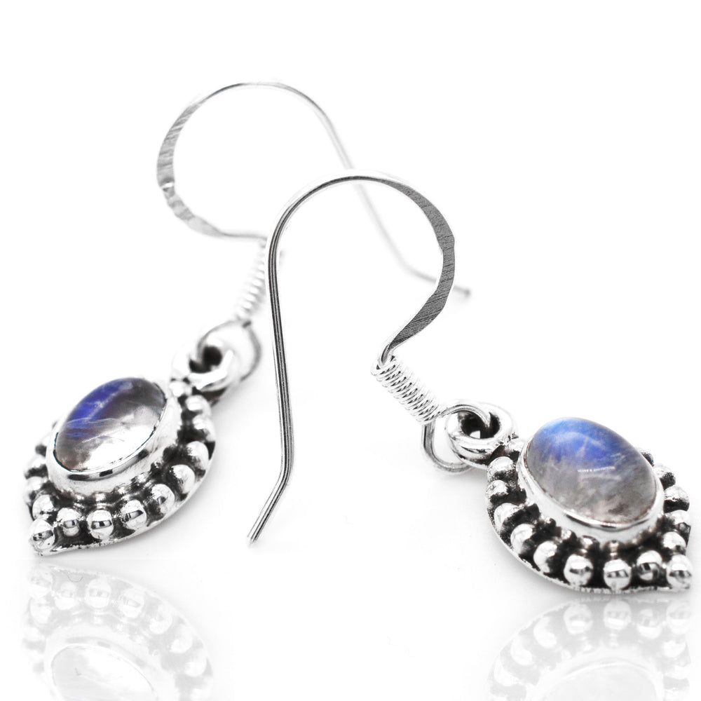 
                  
                    A pair of Super Silver's Dainty Moonstone Earring With Beaded Border.
                  
                