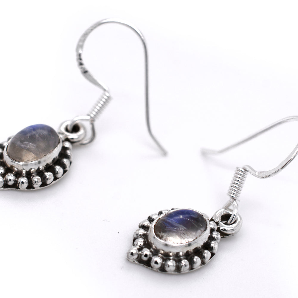
                  
                    A pair of Dainty Moonstone Earrings With Beaded Border from Super Silver.
                  
                