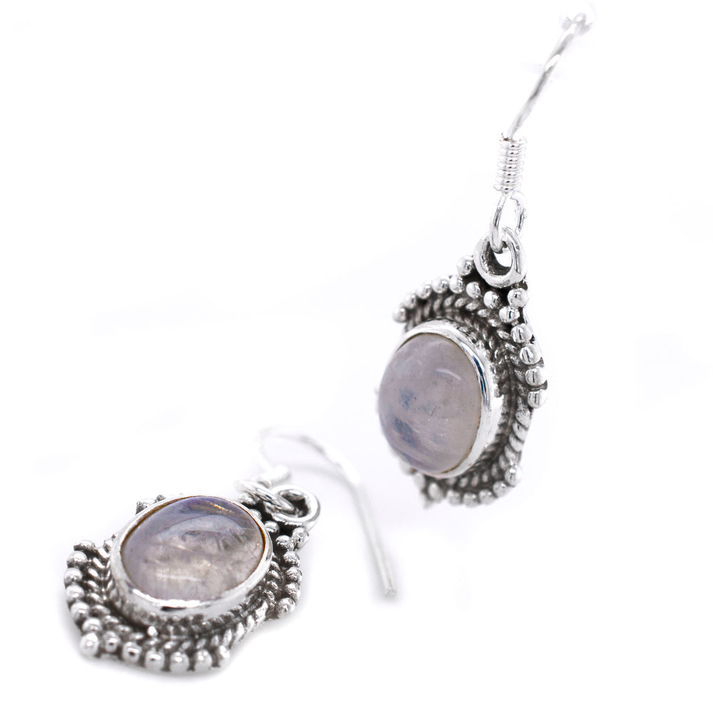 
                  
                    A pair of Super Silver Luminous Oval Moonstone Earrings adorned with a delicate moonstone stone.
                  
                