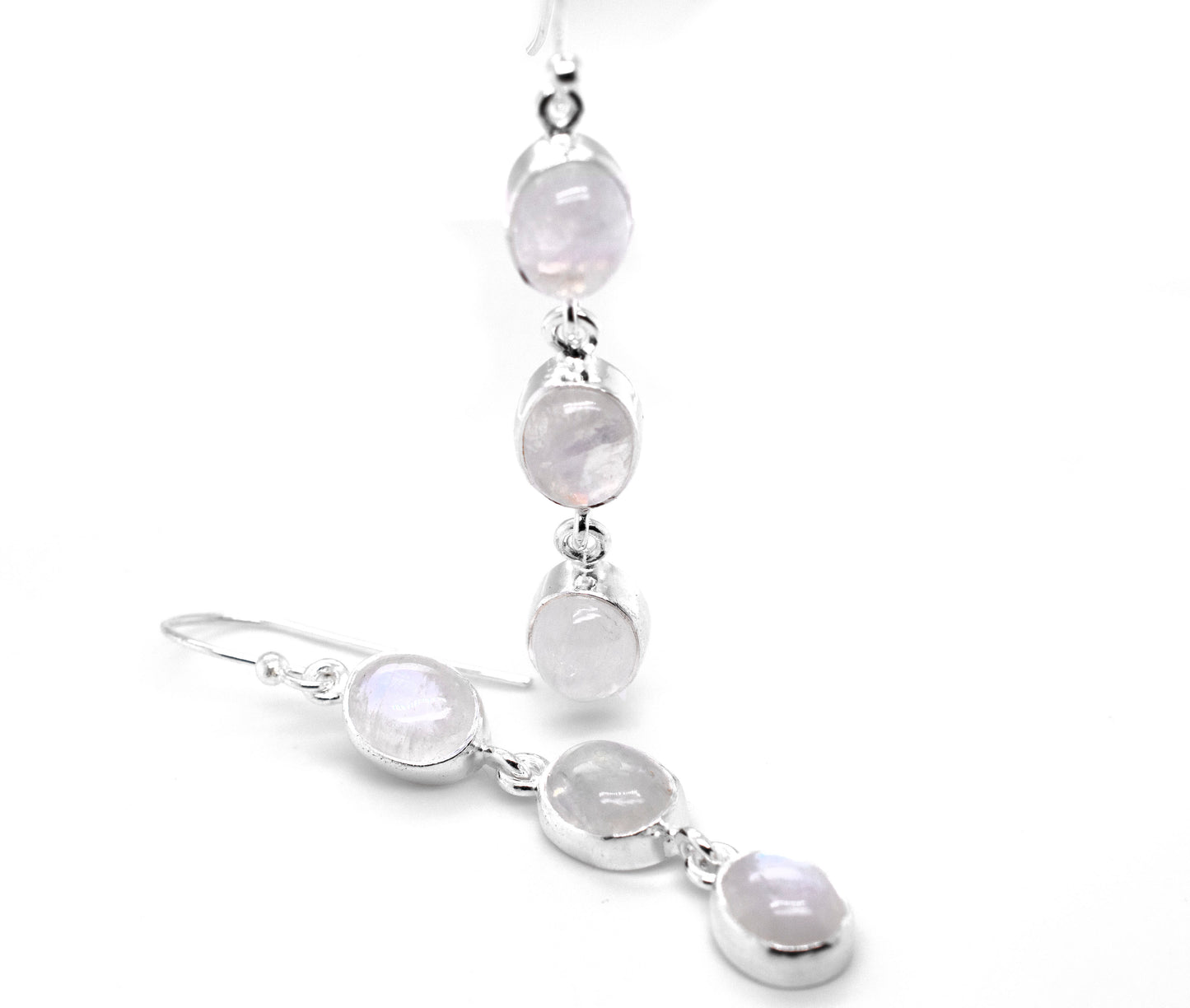 A pair of Radiant Long Earrings with Three Moonstones crafted in .925 sterling silver from Super Silver.