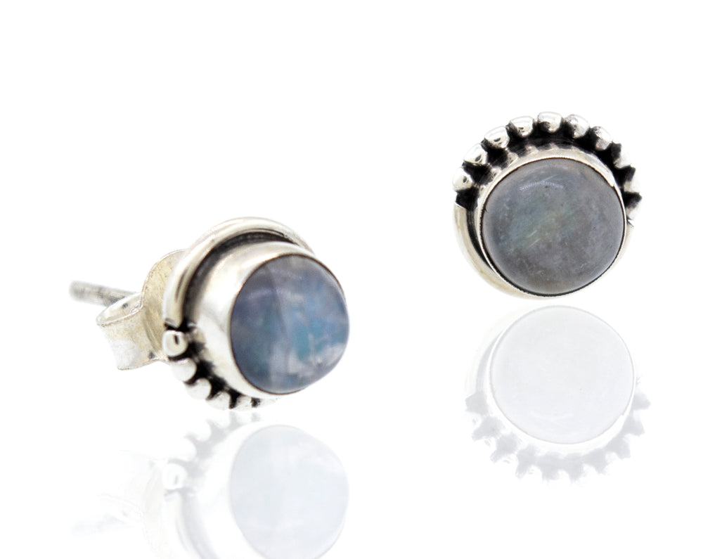 These Small Moonstone Studs with Ball Border earrings, made of .925 sterling silver, feature a stunning 7mm blue stone. Created by Super Silver.