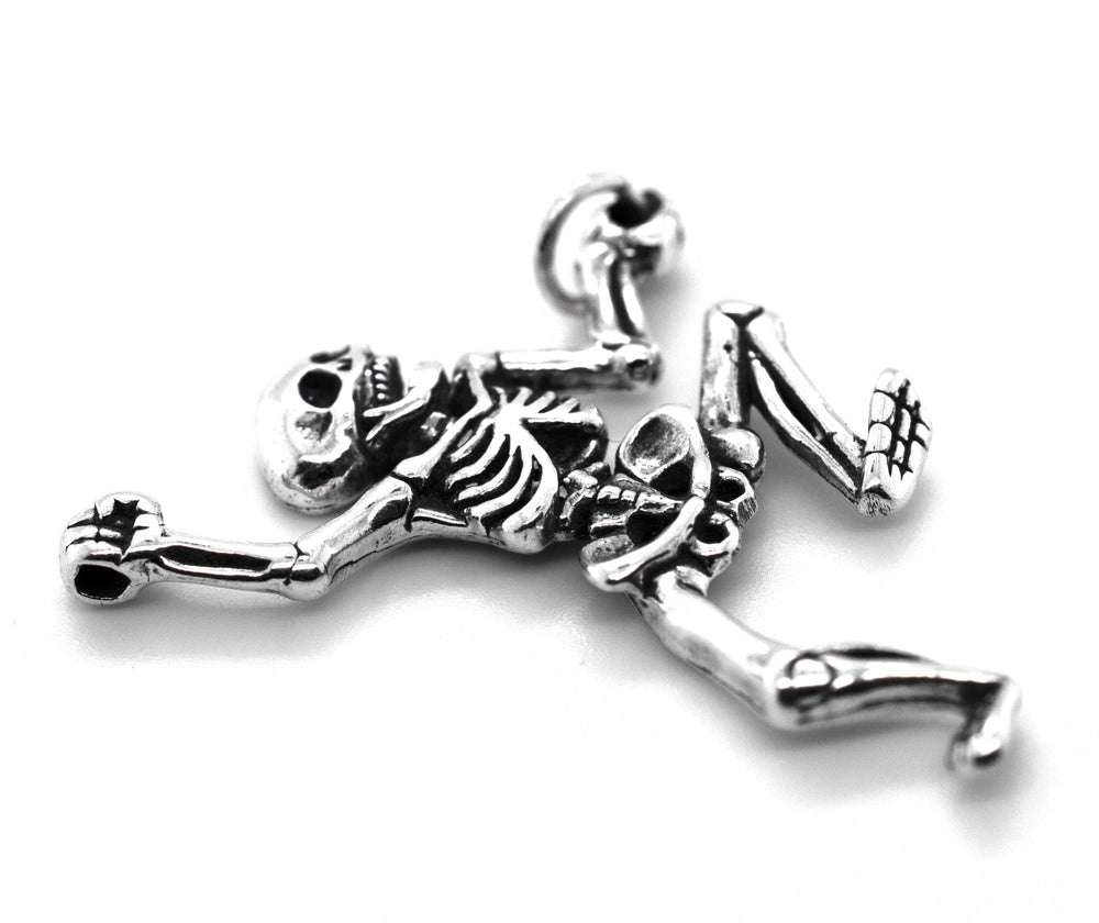A Dancing Skeleton Pendant from Super Silver, perfect for adding a touch of Halloween spirit to your spooky necklace.