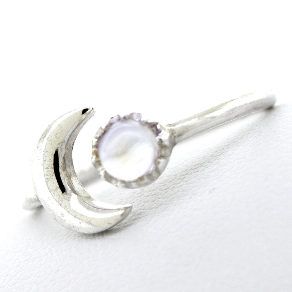 
                  
                    An Online Exclusive Adjustable Moonstone Ring With Moon Design adorned with a moonstone by Super Silver.
                  
                