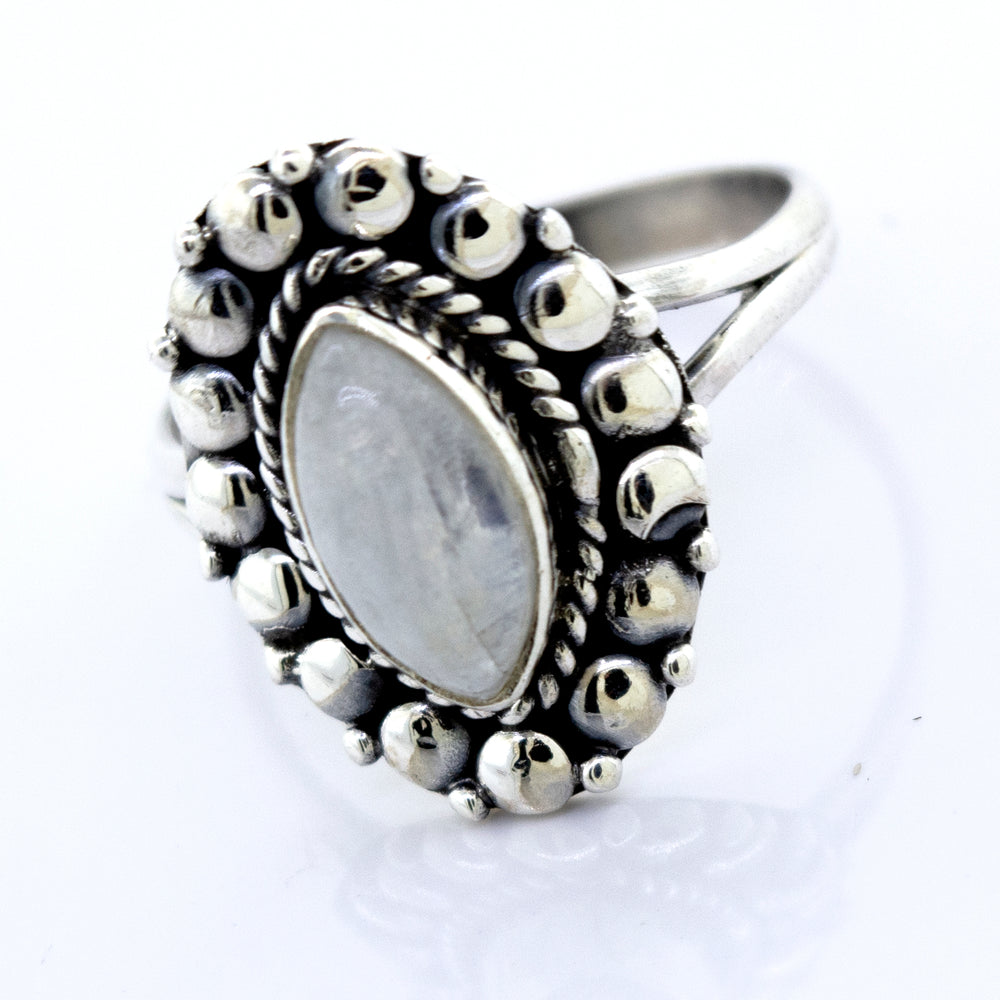 
                  
                    A Marquise Shaped Vibrant Moonstone Ring from Super Silver, with a beaded design in the center.
                  
                