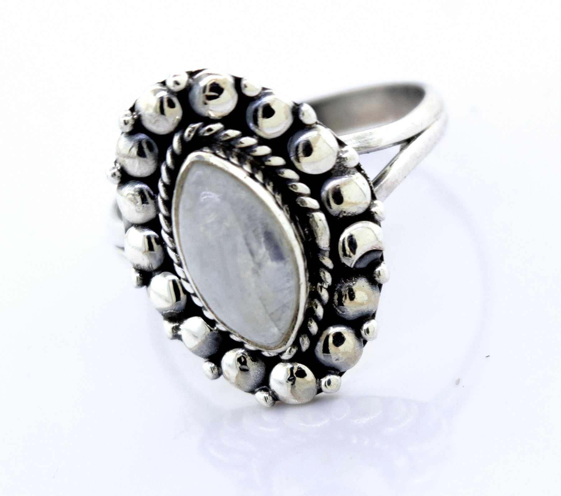 A Marquise Shaped Vibrant Moonstone Ring from Super Silver, with a beaded design in the center.