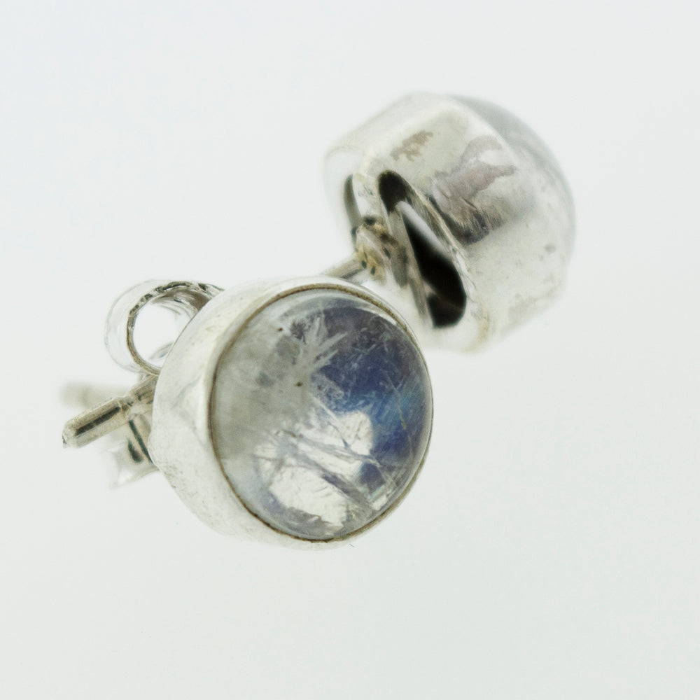 These Simple Circle Moonstone Studs from Super Silver are perfect for everyday wear, featuring a stunning blue stone.