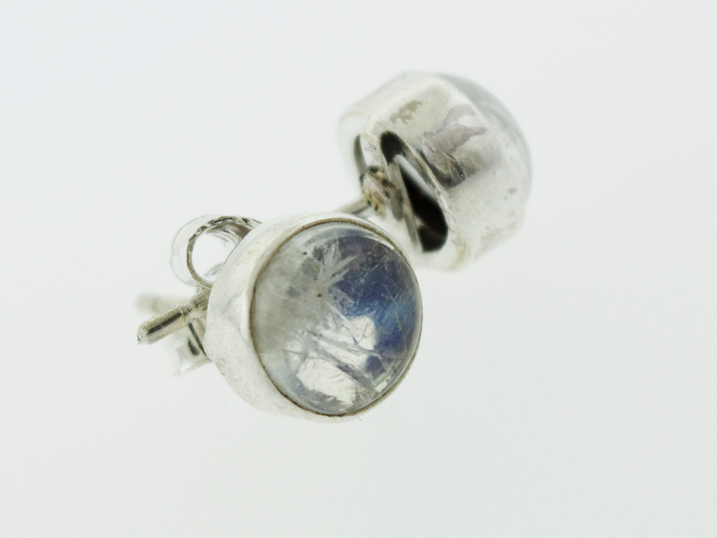These Simple Circle Moonstone Studs from Super Silver are perfect for everyday wear, featuring a stunning blue stone.