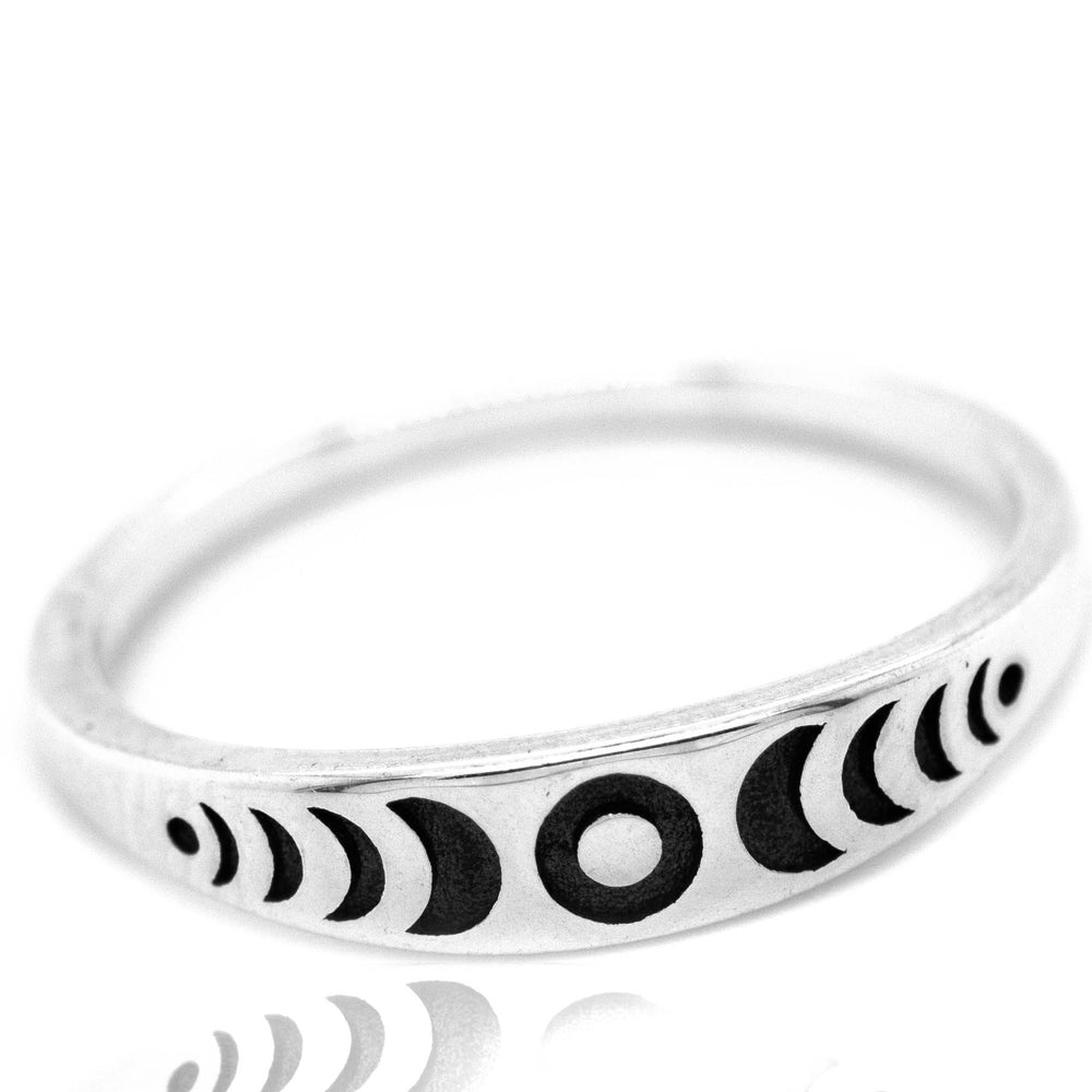 
                  
                    A Moon Phases Band with black and white designs by Super Silver.
                  
                