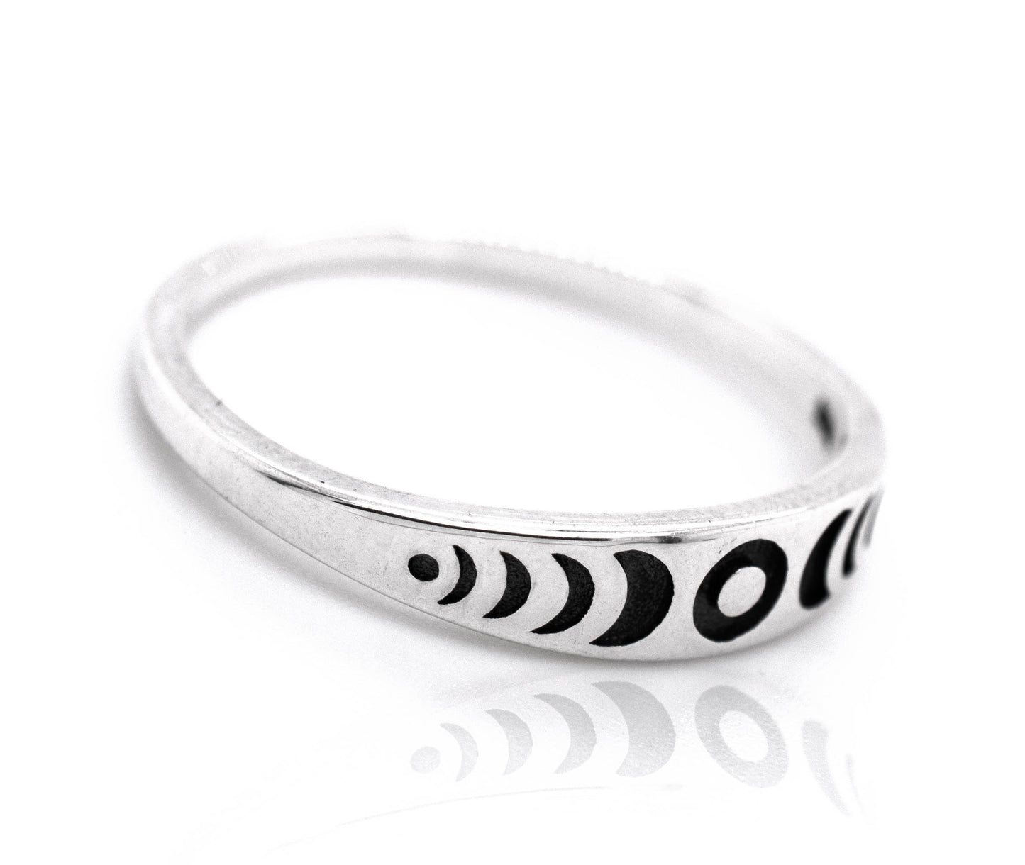 A Super Silver Moon Phases Band adorned with intricate black and white designs inspired by moon phases.