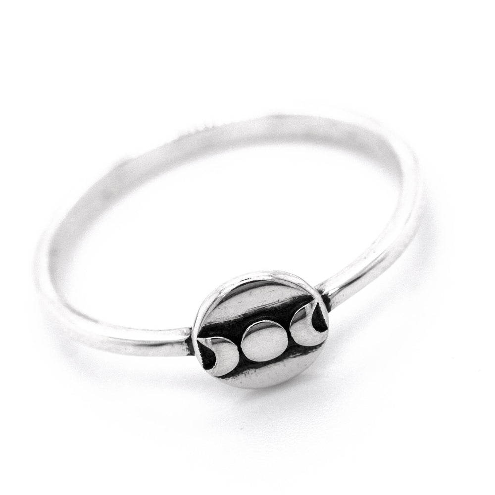 
                  
                    A Dainty Moon Phases Ring with a white ball on it made by Super Silver.
                  
                