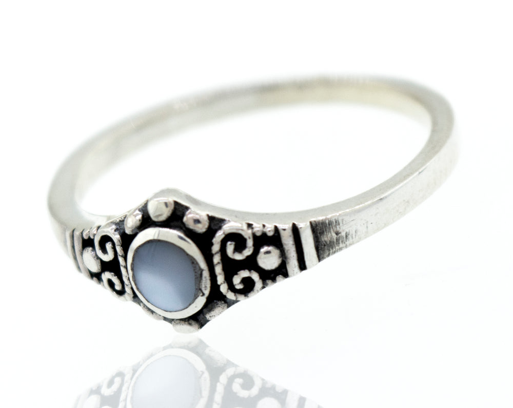 A Super Silver Dainty Inlaid Stone Ring With Silver Beads and Swirls with a blue stone and antiqued finish.