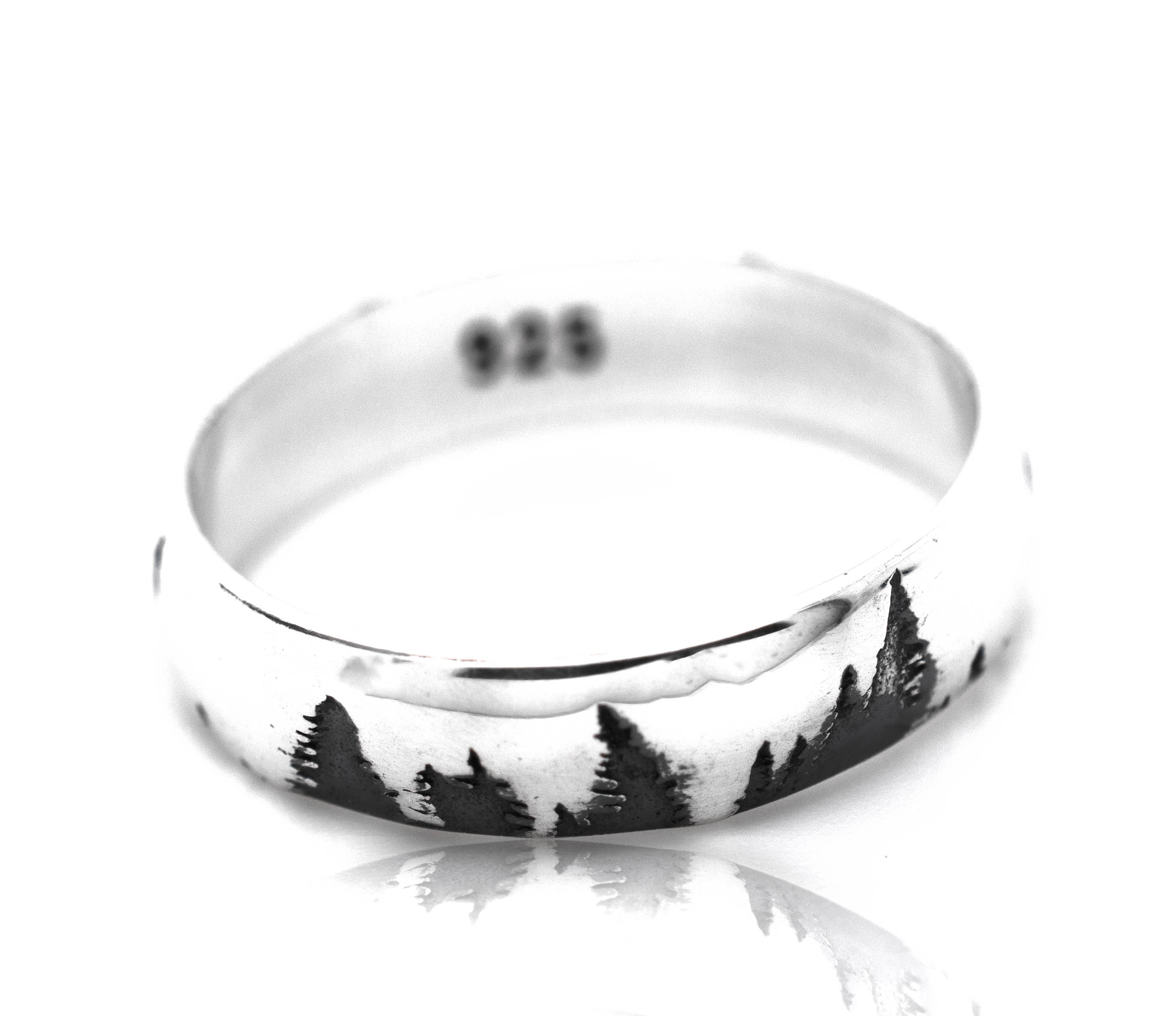 A Sleek Tree Band with a black and white image of pine trees, showcasing the beauty of nature.