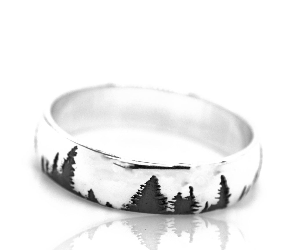 A Sleek Tree Band with a black and white image of trees.
