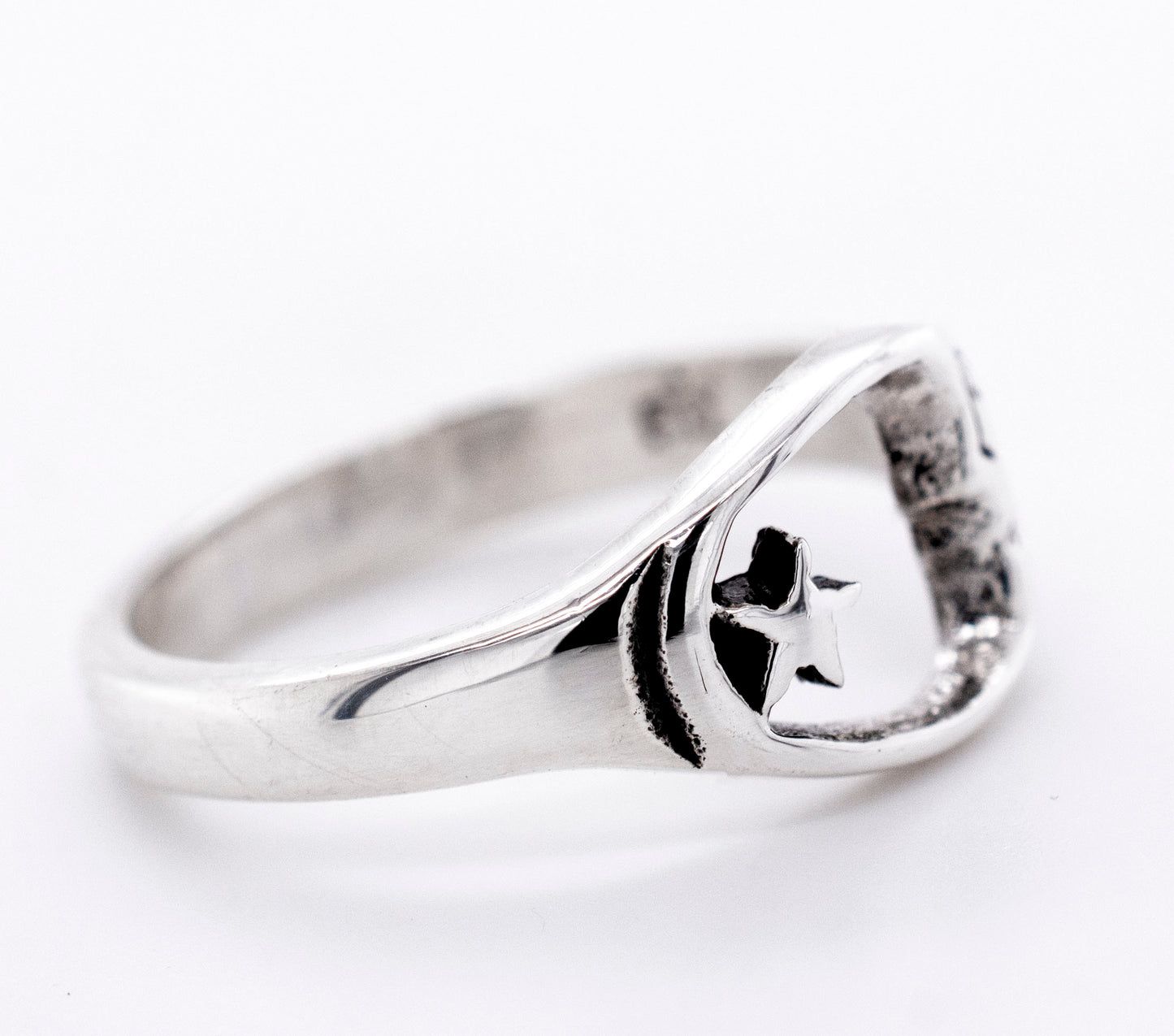 
                  
                    A Crescent Moon With Face And Star Ring, perfect for everyday wear, from Super Silver.
                  
                