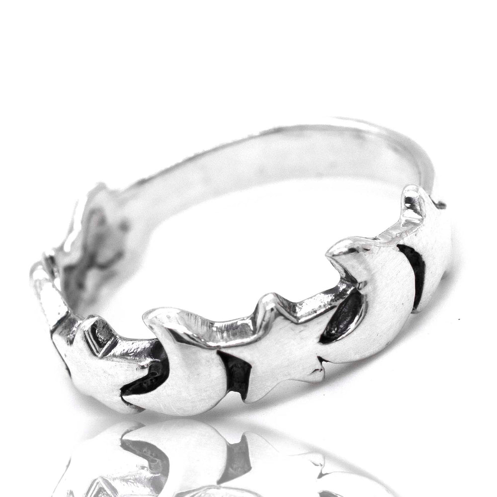 A Super Silver Crescent Moon And Star Band with a star design and crescent moons on it.