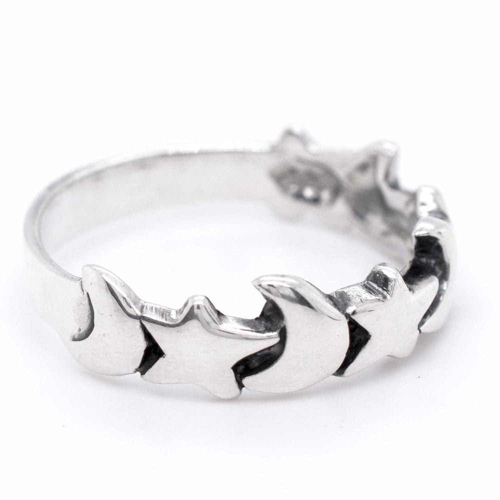 A Super Silver Crescent Moon And Star Band adorned with a mesmerizing star design featuring crescent moons.