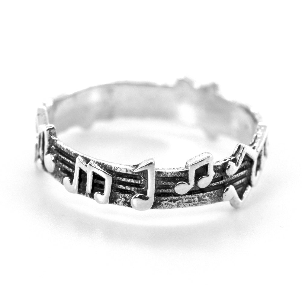 A Super Silver sterling silver band with a music notes design.