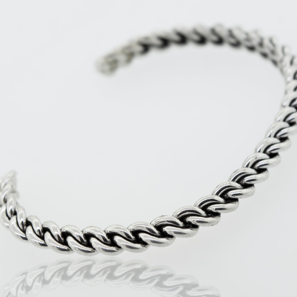 
                  
                    An elegant Super Silver Native American Handmade Silver Woven Link Bracelet on a white surface.
                  
                