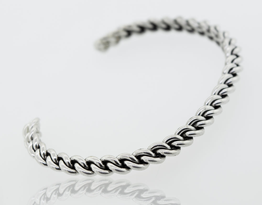 An elegant Super Silver Native American Handmade Silver Woven Link Bracelet on a white surface.