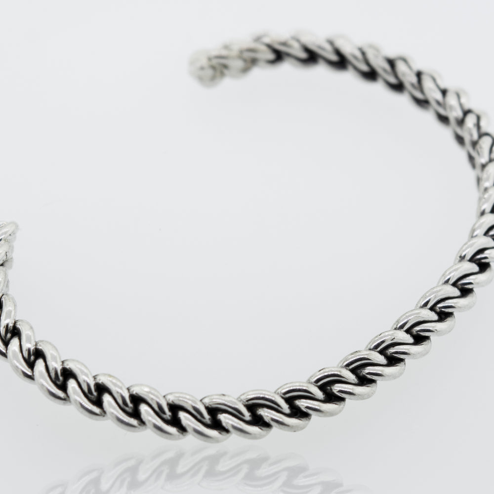 
                  
                    An elegant Native American Handmade Silver Woven Link Bracelet by Super Silver on a white surface.
                  
                
