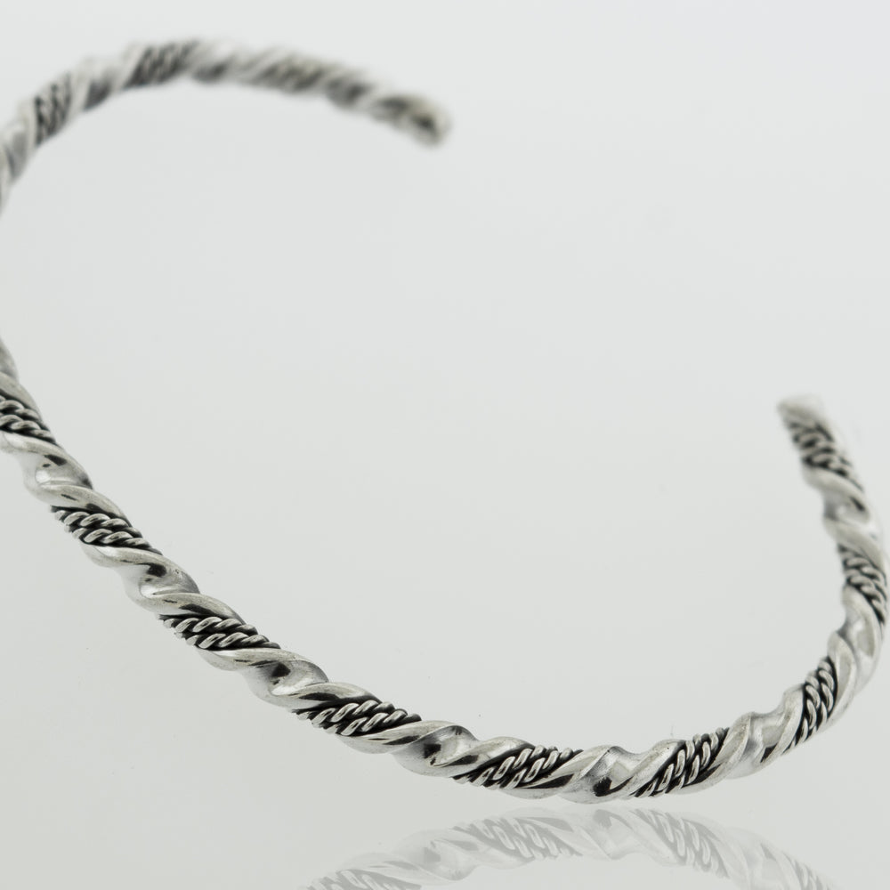
                  
                    An intricate, Super Silver Native American Handmade Silver Rope Twist Cuff bracelet.
                  
                