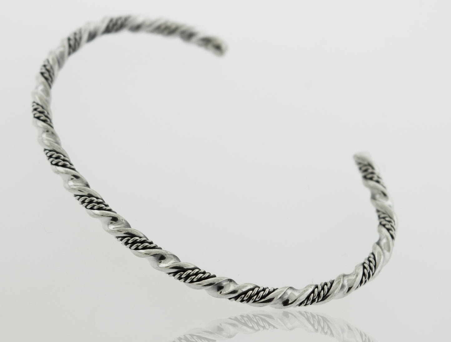 
                  
                    An intricate, Super Silver Native American Handmade Silver Rope Twist Cuff bracelet.
                  
                
