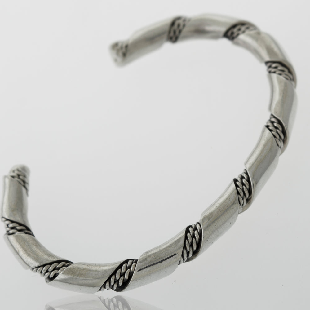 An elegant statement piece, this Native American Handmade Thick Silver Twist Cuff bracelet with a braided design is made from .925 Sterling Silver.
