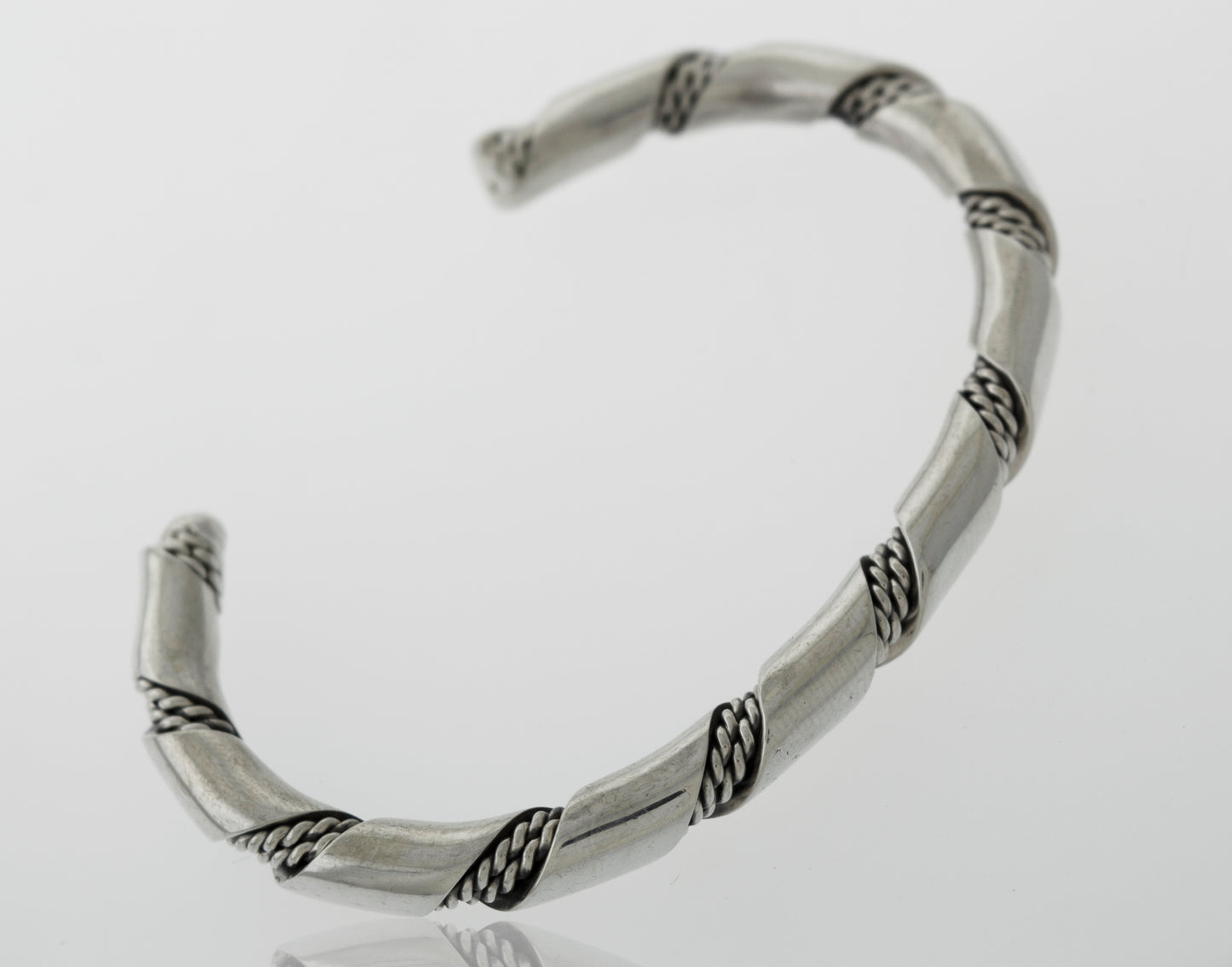 An elegant statement piece, this Native American Handmade Thick Silver Twist Cuff bracelet with a braided design is made from .925 Sterling Silver.