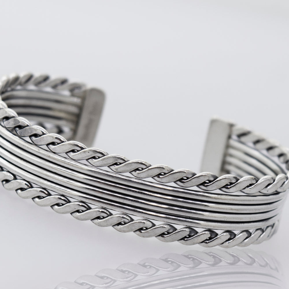 A Native American Handmade Thick Silver Cuff with a Rope Border by Super Silver, a statement piece.