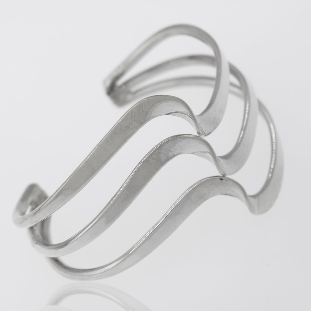 A Native American Handmade Silver Triple Wave Cuff bracelet by Super Silver that shines gracefully.