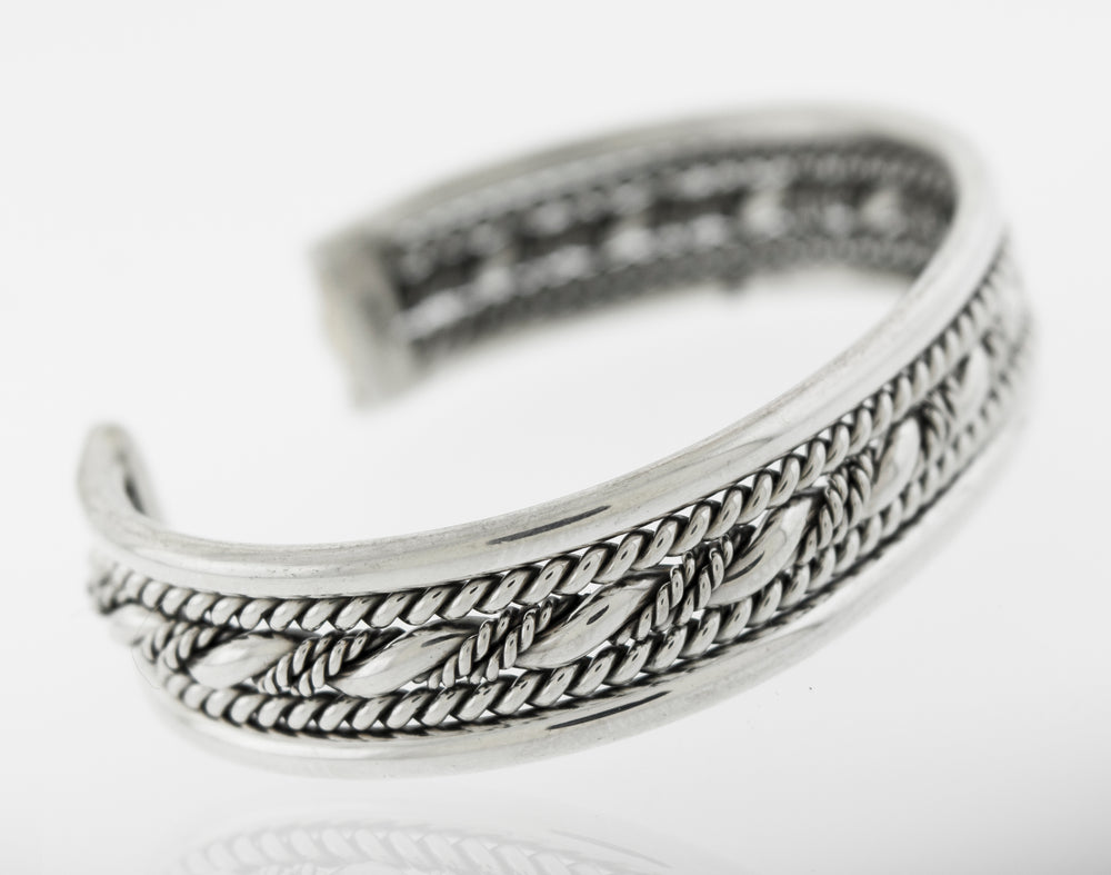 A bold piece of jewelry, the Native American Handmade Intricate Silver Cuff bracelet from Super Silver with a braided design is sure to turn heads with its stunning Sterling Silver composition.
