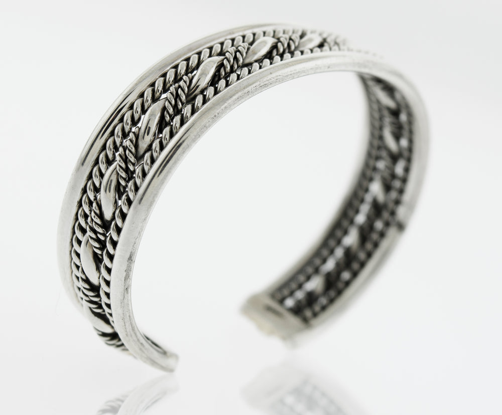 
                  
                    A bold piece of jewelry, the Native American Handmade Intricate Silver Cuff from Super Silver features a stylish braided design that is sure to turn heads.
                  
                