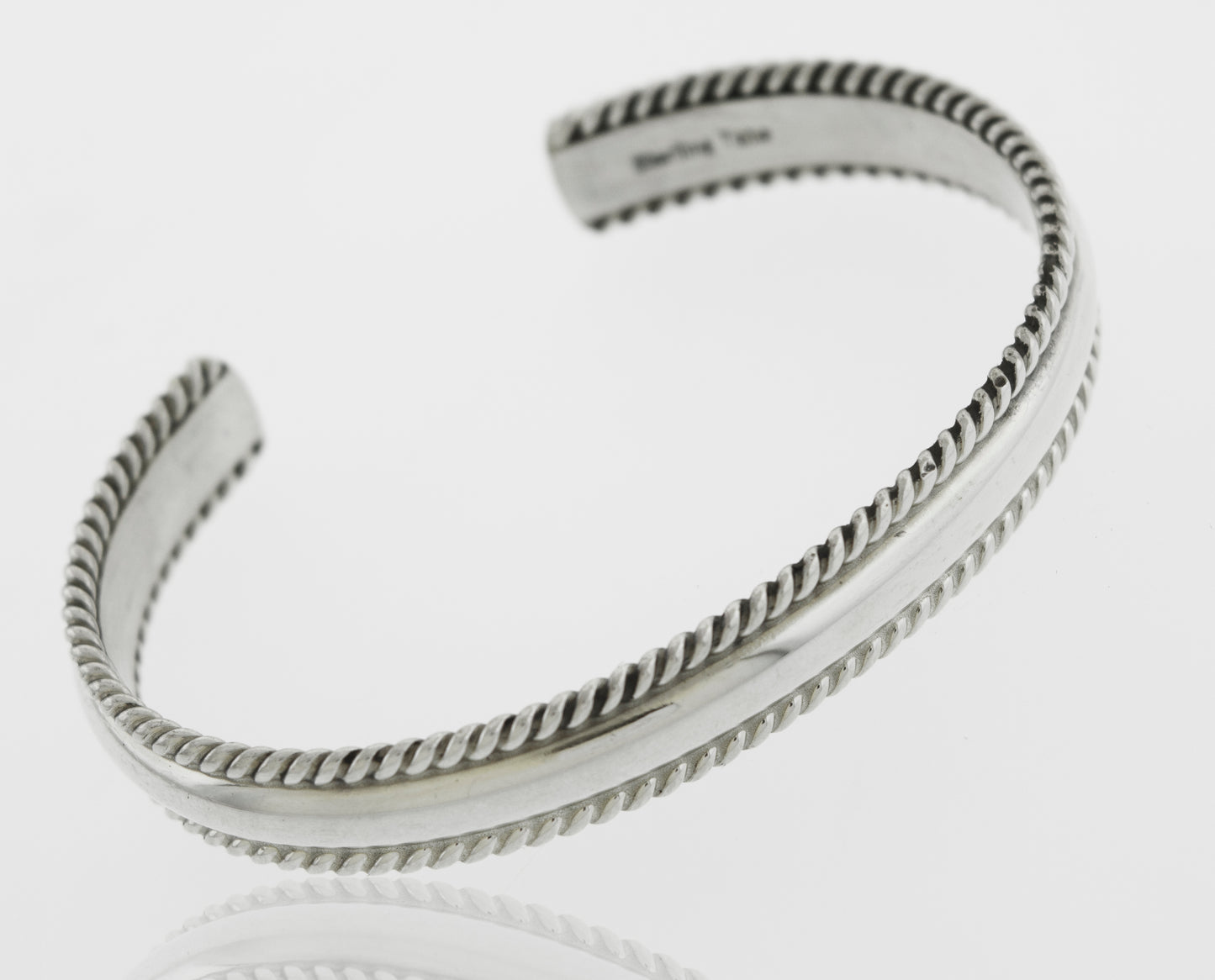 A beautiful Native American Handmade Silver Rope Cuff by Super Silver with a unique braided design.