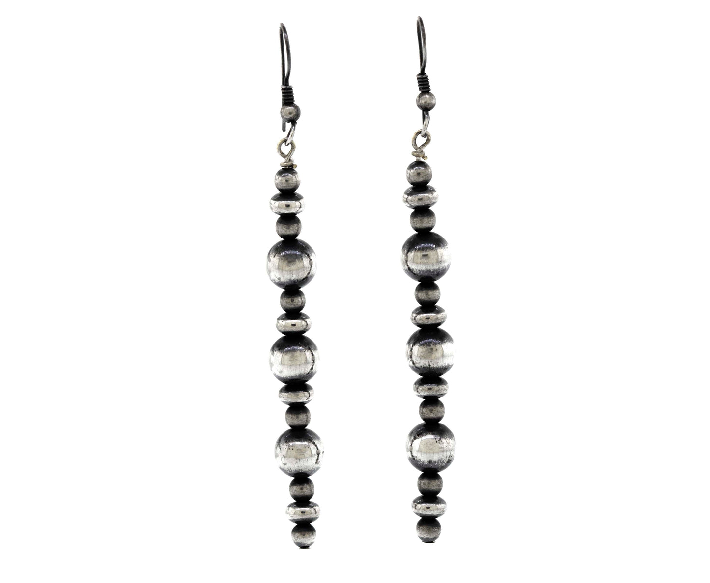 A pair of Long Handcrafted Navajo Pearl earrings from Super Silver with an oxidized finish on a white background.