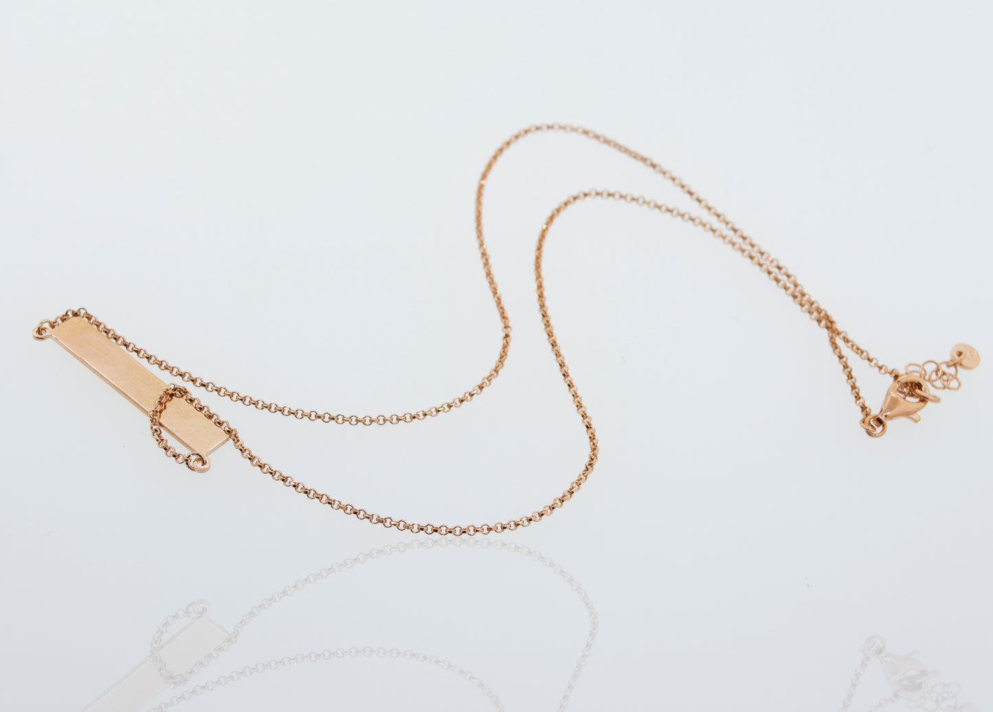 
                  
                    A Super Silver dainty rose gold necklace with an adjustable chain, the Dainty Nameplate Necklace.
                  
                
