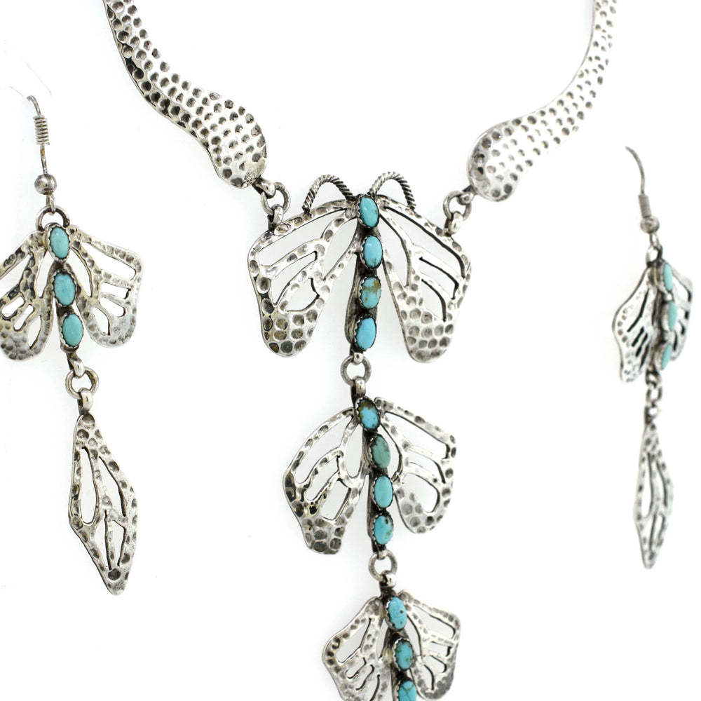 A Super Silver Handmade Turquoise Dragonfly Necklace And Earring Set with a touch of turquoise.