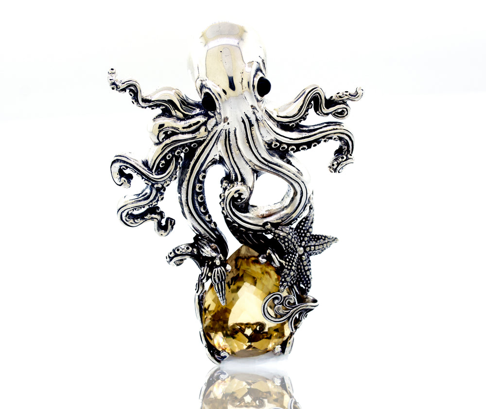 A captivating Super Silver octopus ring adorned with a Designer Handmade Octopus Pendant With Vibrant Citrine Crystal.
