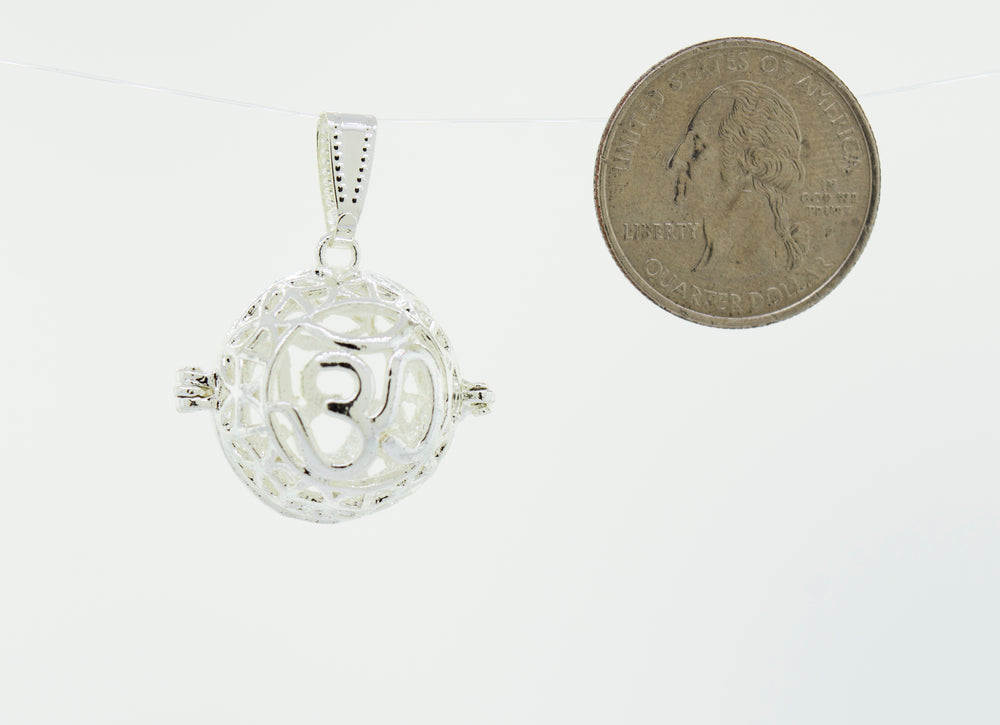 A Super Silver Om Cage Pendant with a special keepsake penny.