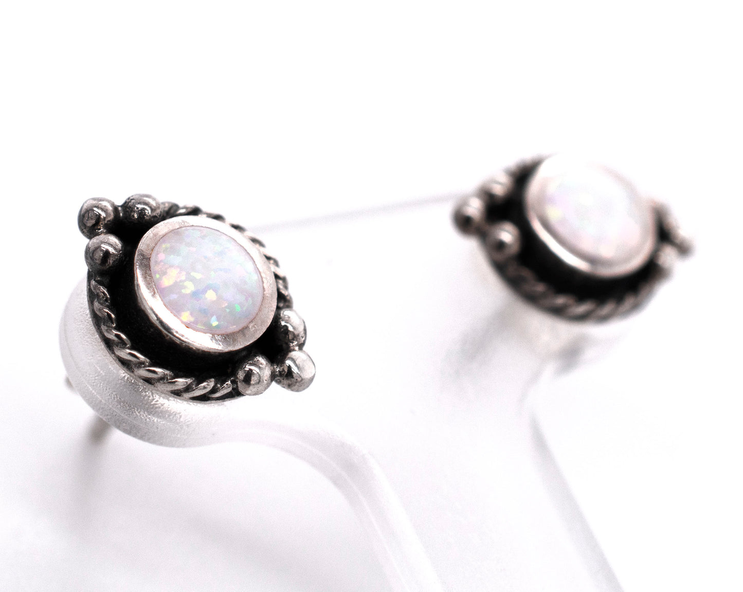 
                  
                    A pair of Super Silver Bali Style Opal Stud Earrings, featuring white opal, on a white background.
                  
                