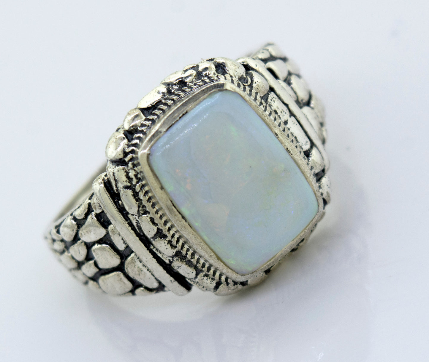 
                  
                    A minimalist sterling silver ring with an Australian Opal Signet Ring With Dragon Scale Pattern stone.
                  
                