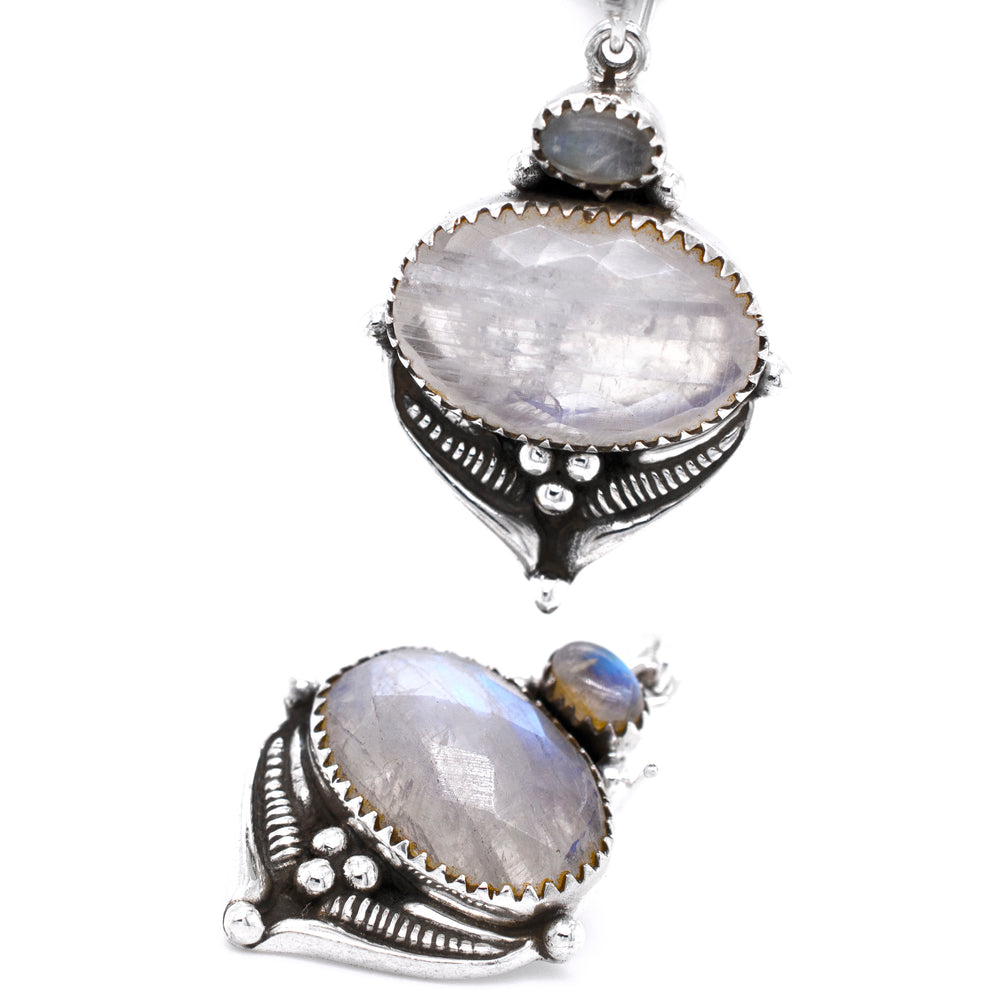 
                  
                    A pair of Super Silver Spectacular Faceted Gemstone Earrings adorned with a moonstone stone, perfect for boho hippy chic style.
                  
                