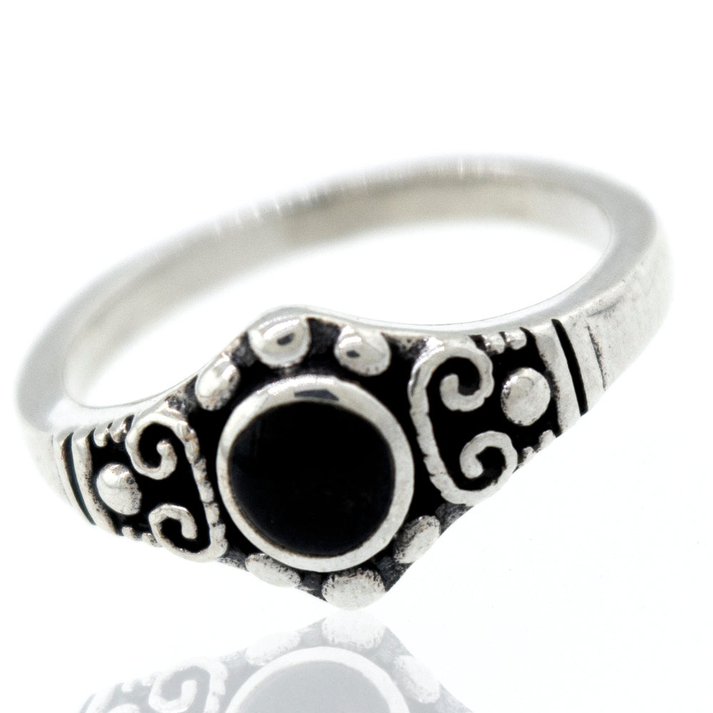
                  
                    A Dainty Inlaid Stone Ring With Silver Beads and Swirls from Super Silver, with a vintage charm and an antiqued finish, featuring a black onyx stone.
                  
                