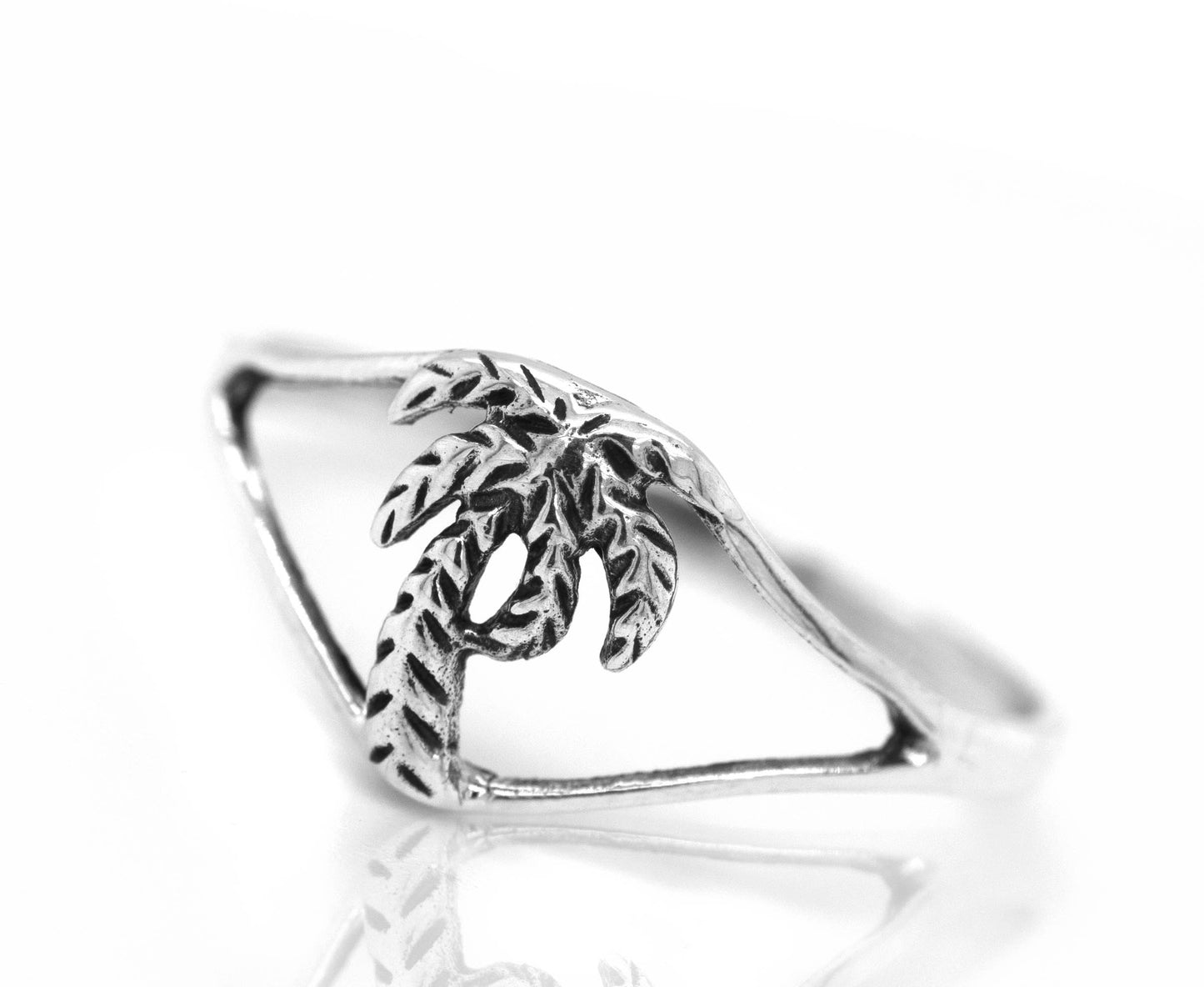 
                  
                    A delicate palm tree ring with a palm tree on it.
                  
                